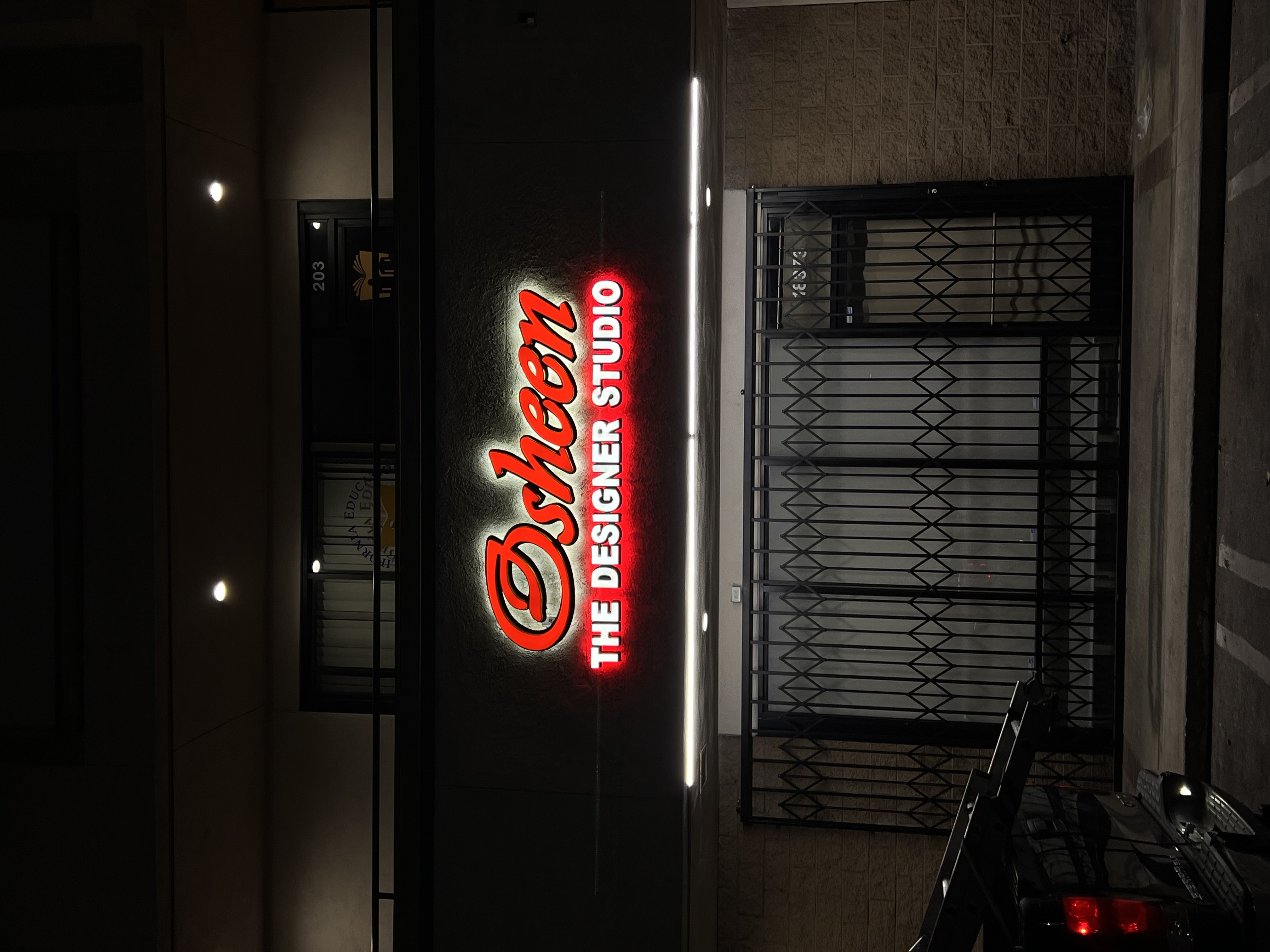 Osheen Designer Studio backlit sign