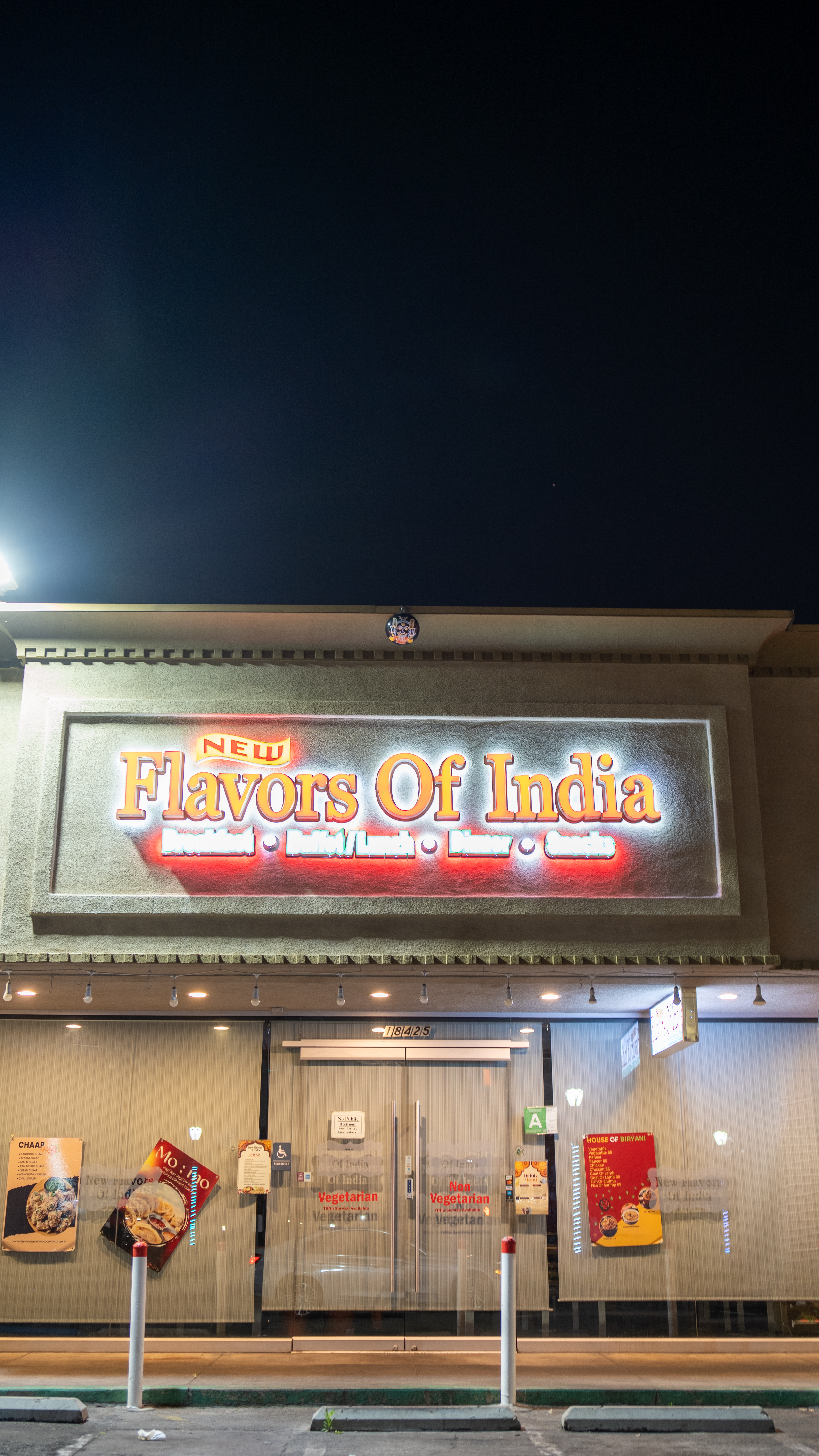 Flavors of India illuminated storefront