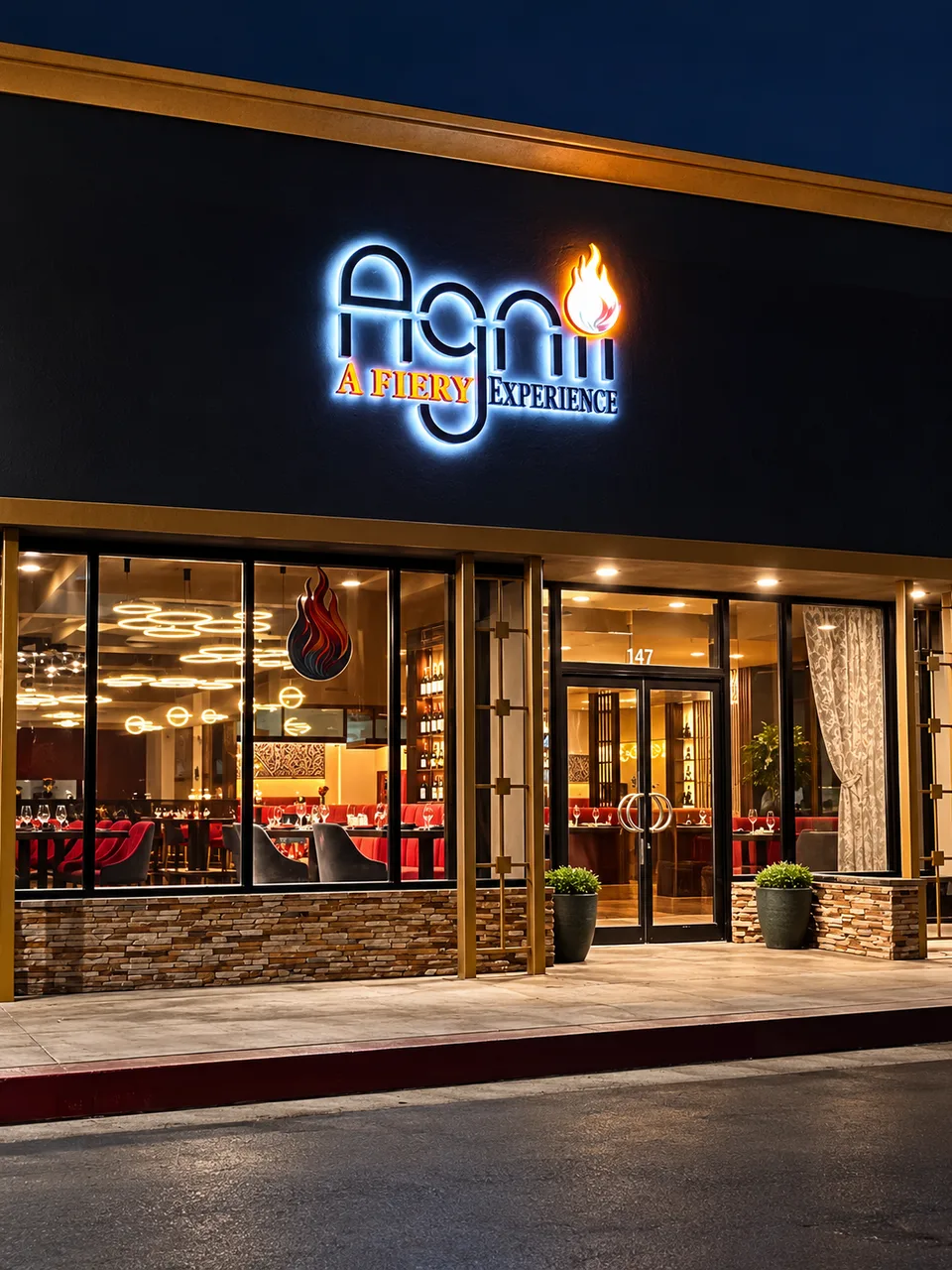 Agni restaurant illuminated logo above its completed storefront