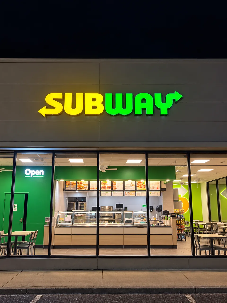 Subway yellow and green illuminated storefront lettering