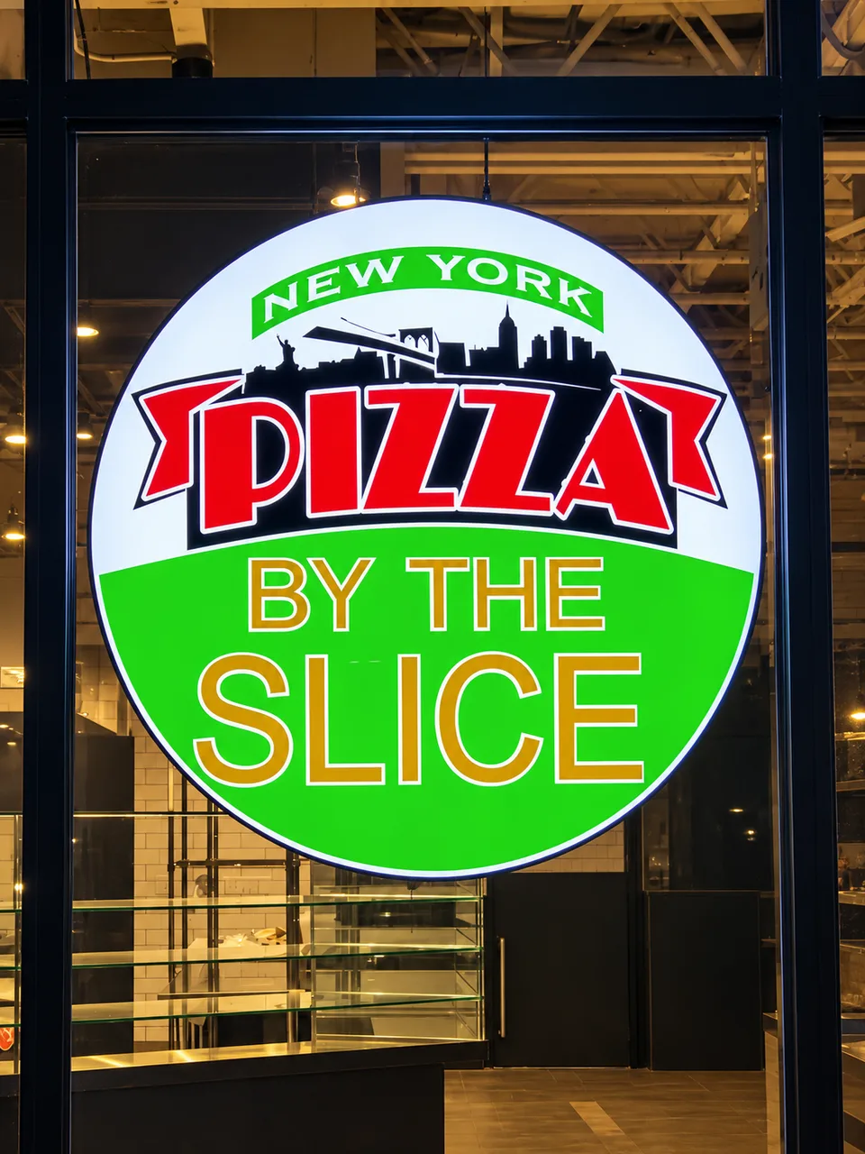 New York Pizza by the Slice illuminated circular window sign