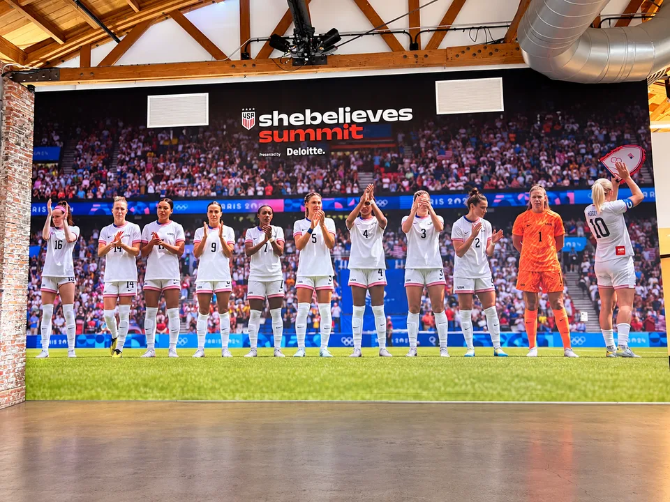 Full-wall printed US women's soccer team mural
