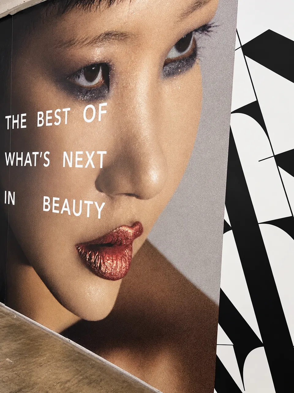Printed beauty advertising graphic on an interior wall panel