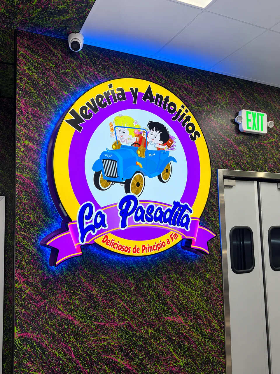 La Pasadita custom illuminated interior logo with a pink halo