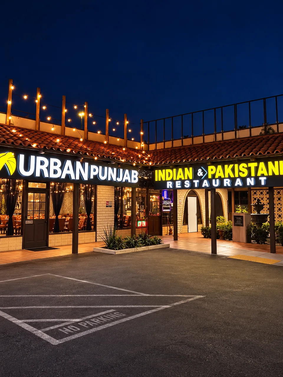 Urban Punjab illuminated courtyard storefront signs